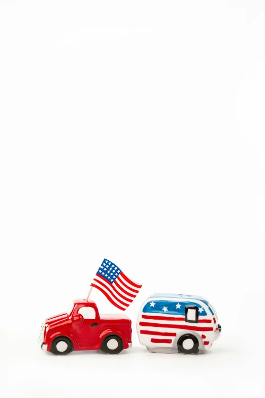 a couple of toy cars sitting next to each other, by Brian Alfred, folk art, usa flag, platon, camper, usa-sep 20