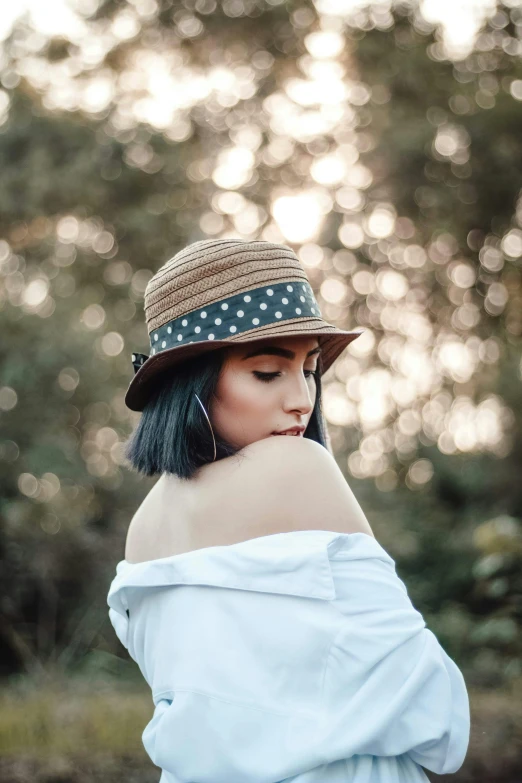 a woman with blue hair wearing a hat, inspired by Elsa Bleda, trending on pexels, polka dot, brown, beautiful lonely girl, attractive photo