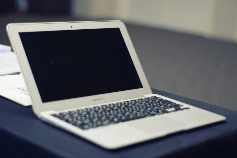 a laptop computer sitting on top of a table, unsplash, paul barson, jets, in 2 0 1 2, dingy