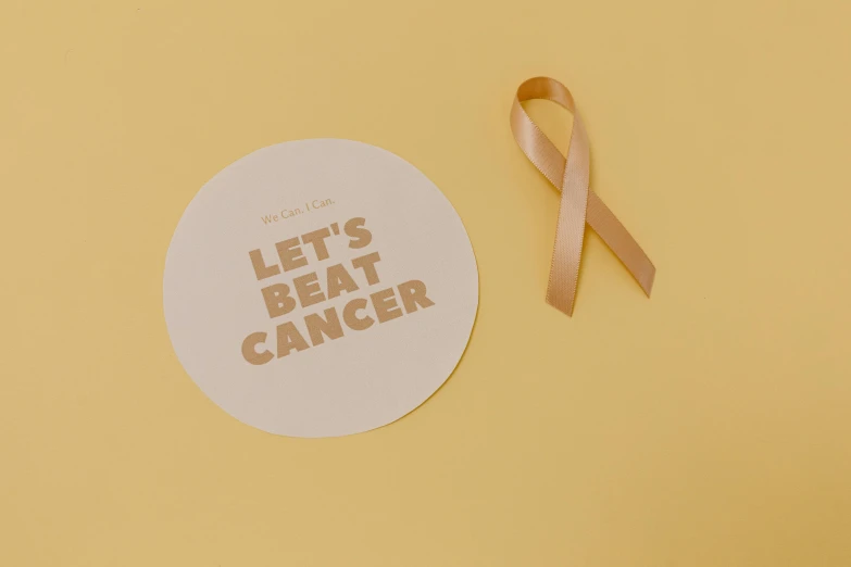 a sticker that says let's beat cancer next to a pink ribbon, pexels contest winner, lyco art, a round minimalist behind, ocher, product introduction photo, light toned