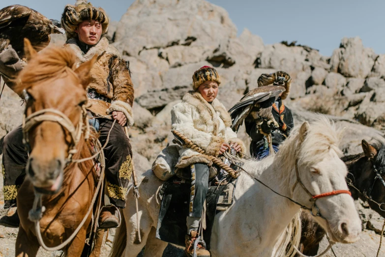 a group of people riding on the backs of horses, a portrait, trending on unsplash, hurufiyya, wearing intricate fur armor, award winning film, anton fedeev, sha xi