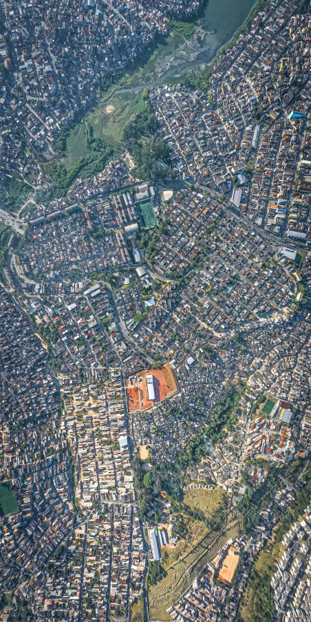 an aerial view of a city with lots of buildings, an album cover, by Fletcher Martin, trending on unsplash, nepal, 8 k hyper detailed image, são paulo, shipibo