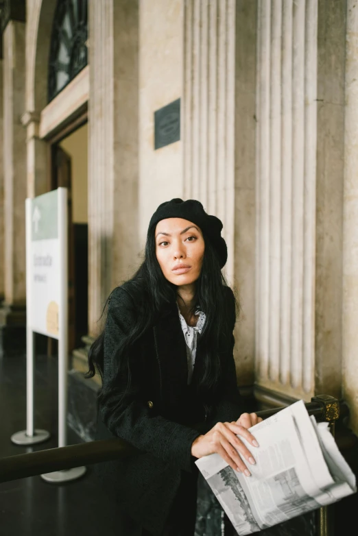 a woman sitting on a bench reading a newspaper, by Nina Hamnett, pexels contest winner, renaissance, sui ishida with black hair, national portrait gallery, with black beanie on head, promotional image