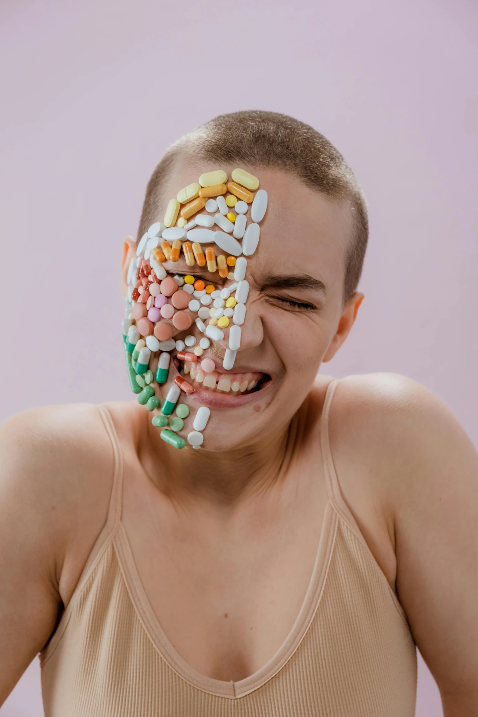 a woman with a lot of pills on her face, an album cover, trending on pexels, antipodeans, emaciated shaved face, lesbians, maxim sukharev, strong defined jaw