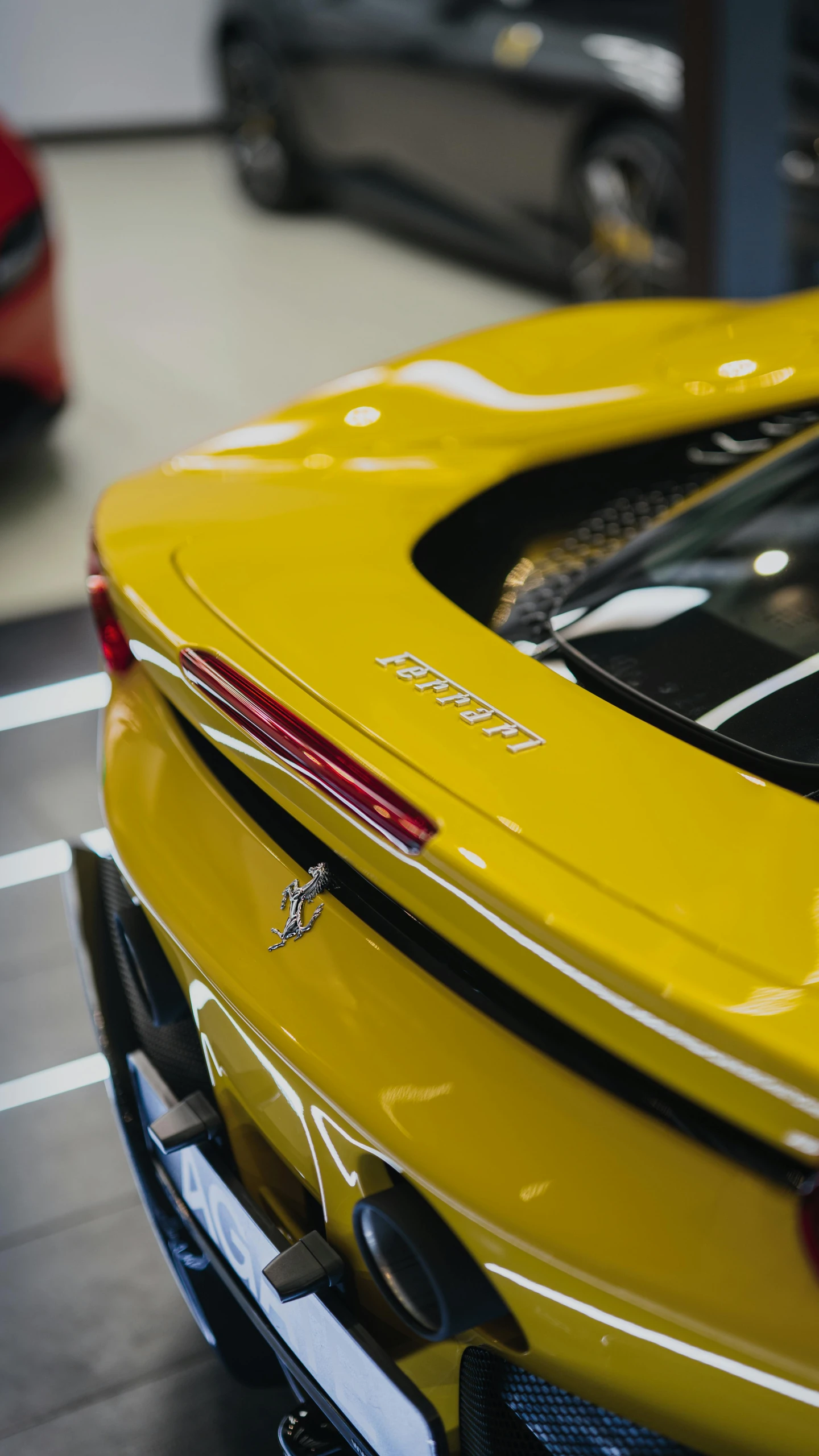 a yellow sports car parked in a showroom, by Tom Bonson, unsplash, rear-shot, high body detail, f12, high quality photo