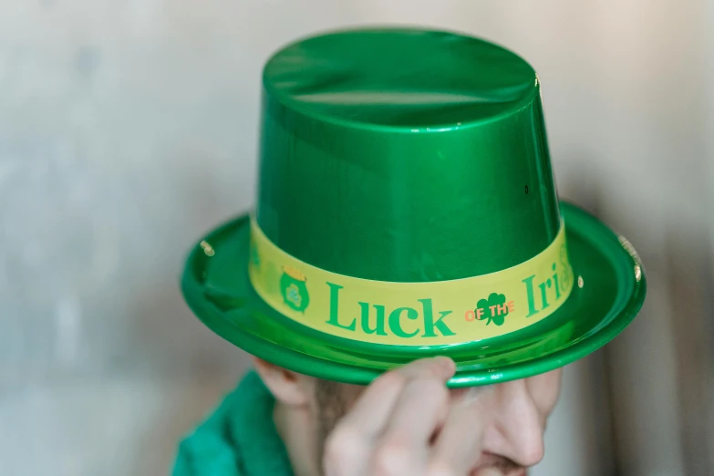 a close up of a person wearing a green hat, a photo, hq print, irish, trick, holiday