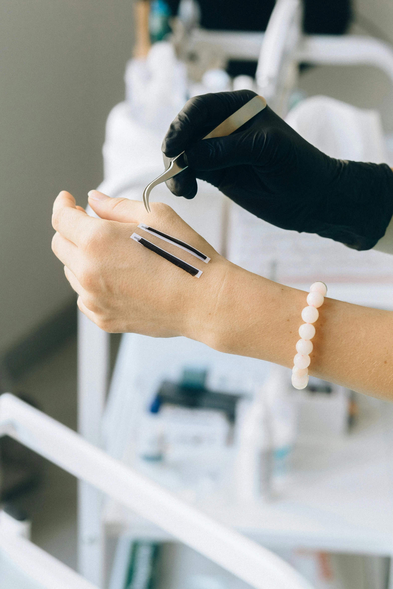 a woman getting her nails done in a beauty salon, by Adam Marczyński, instagram, pathology sample test tubes, black bandage on arms, transparent background, made of lab tissue