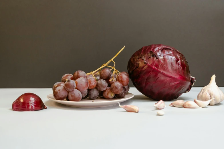 a close up of a plate of food on a table, a still life, inspired by Caravaggio, hyperrealism, red and purple, ignant, grey vegetables, full body image