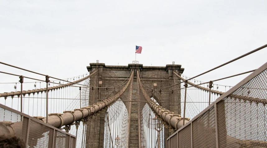 a group of people standing on top of a bridge, inspired by Thomas Struth, pexels contest winner, hurufiyya, brooklyn, from marvel studios, view from front, hanging veins