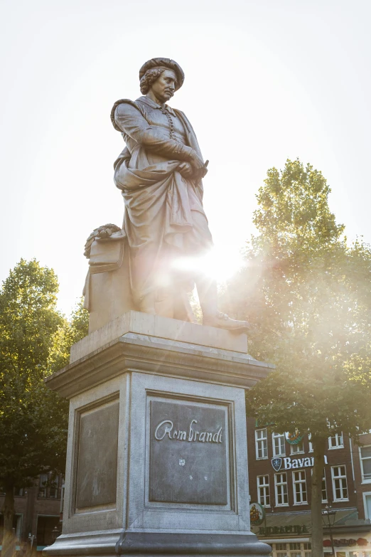 a statue of a woman standing in front of a building, inspired by Carl Frederik von Breda, happening, sun behind him, warmly lit, lush surroundings, low dutch angle