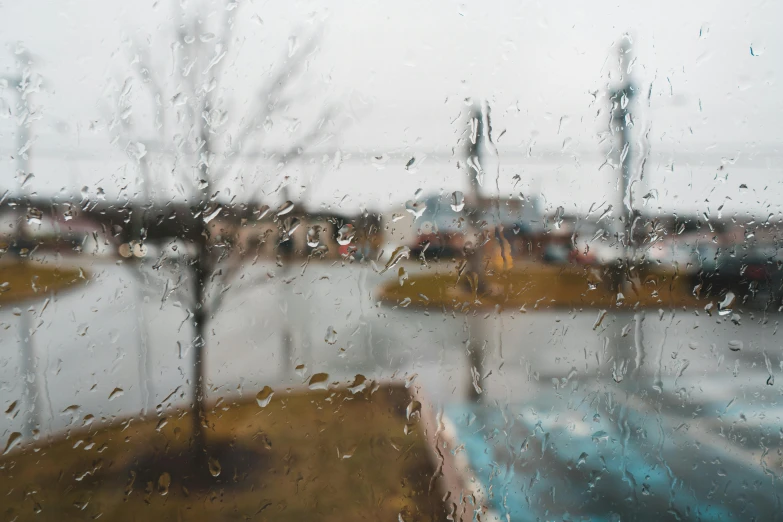 a person looking out a window on a rainy day, pexels contest winner, visual art, bokeh on side of the river, waterline refractions, paul barson, photograph of april