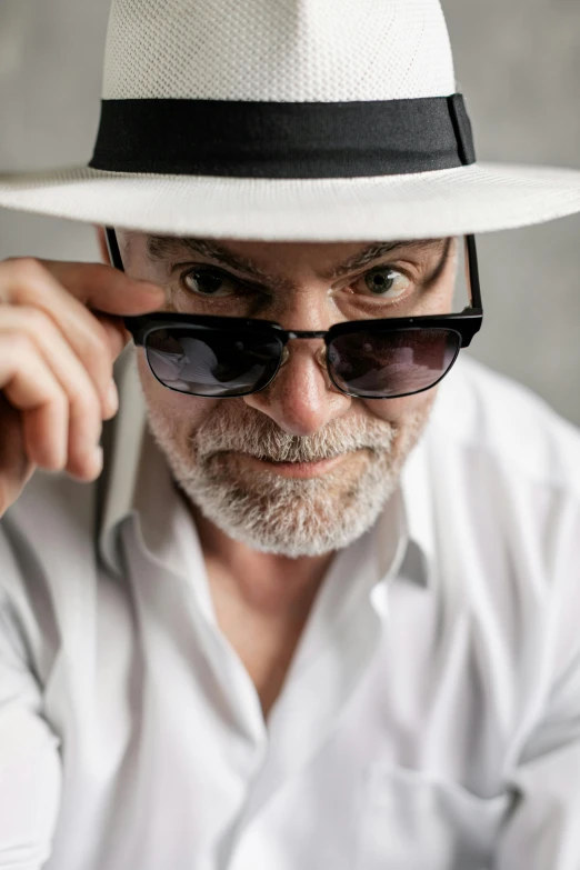 a man wearing a white hat and sunglasses, inspired by Karl Buesgen, unsplash, short white beard, looking threatening, alan grey, silver silver glasses