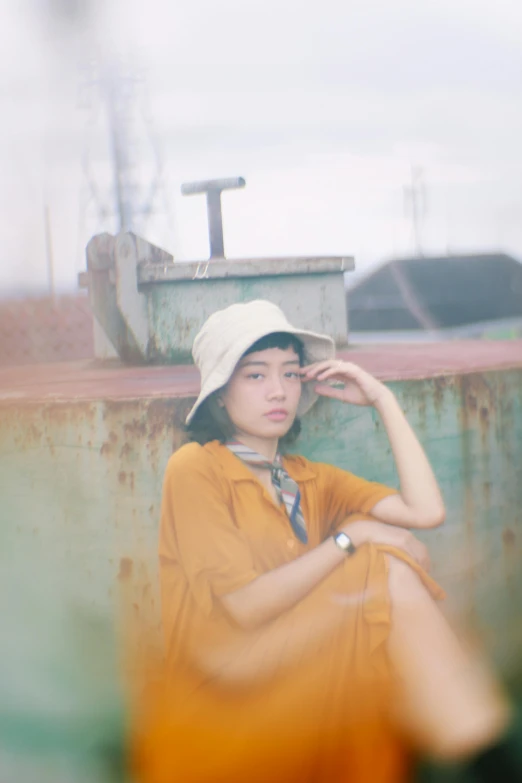 a woman in an orange dress and a white hat, a picture, by Tan Ting-pho, unsplash, realism, faded color film, portrait of a japanese teen, bucket hat, ((portrait))