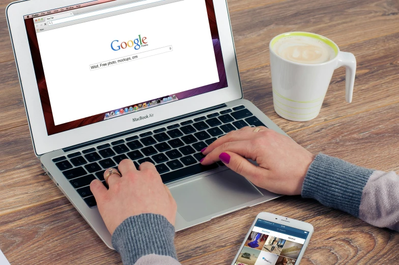 a person typing on a laptop next to a cup of coffee, by Niko Henrichon, pixabay, renaissance, google logo, 15081959 21121991 01012000 4k, google images search result, many computer screens