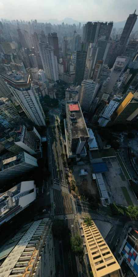 an aerial view of a city with tall buildings, by Felipe Seade, pexels contest winner, photorealism, sao paulo in the year 2 0 7 0, alessio albi, low quality photo, taken on go pro hero8