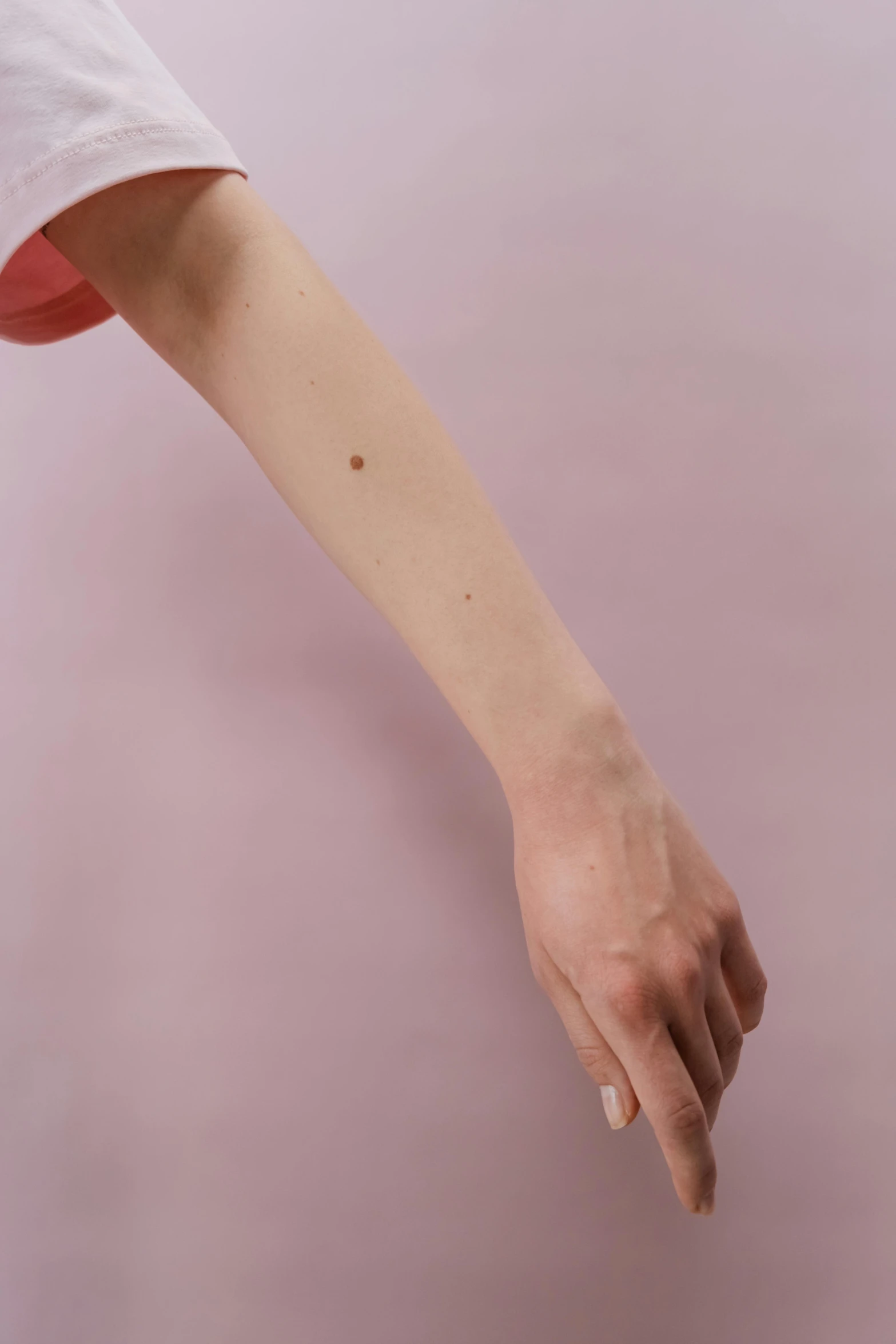 a close up of a person holding a tennis racquet, a tattoo, by Gavin Hamilton, white with chocolate brown spots, ignant, dot gradient, crying and reaching with her arm