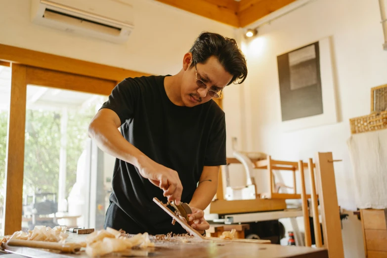 a man is cutting onions on a cutting board, a portrait, inspired by Yukimasa Ida, pexels contest winner, sculptor, lachlan bailey, looking partly to the left, hoang lap