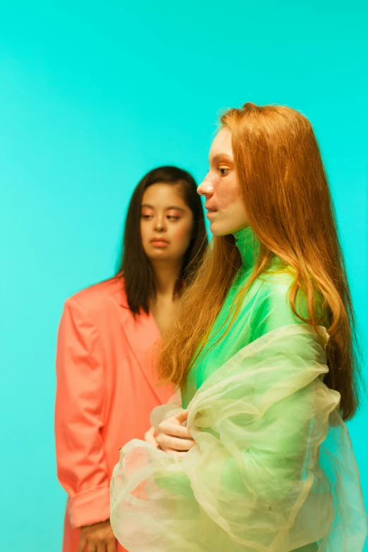 a couple of women standing next to each other, an album cover, chartreuse and orange and cyan, hr ginger, looking to the side off camera, gongbi