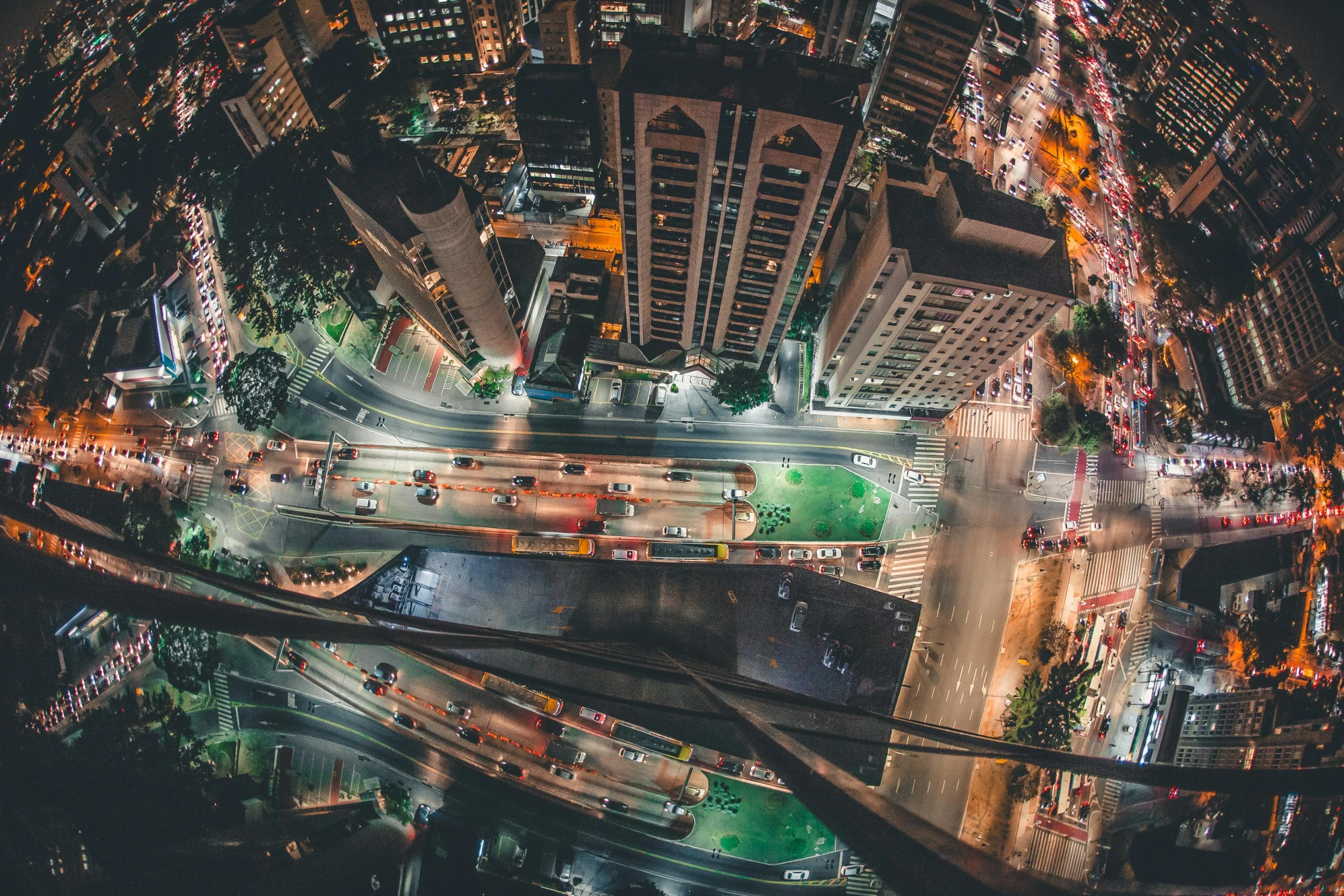 an aerial view of a city at night, pexels contest winner, hanging upside down, in sao paulo, sky bridge, bird's eye