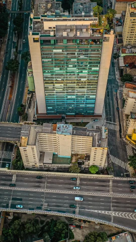 an aerial view of a busy city street, by Felipe Seade, concrete building, brazilian, 8 k photo, square