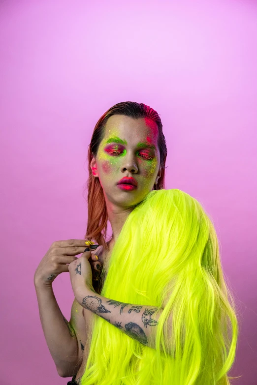 a woman with bright yellow hair posing in front of a pink background, an album cover, inspired by Elsa Bleda, trending on pexels, portrait of two people, green colored skin, lesbian embrace, bella poarch