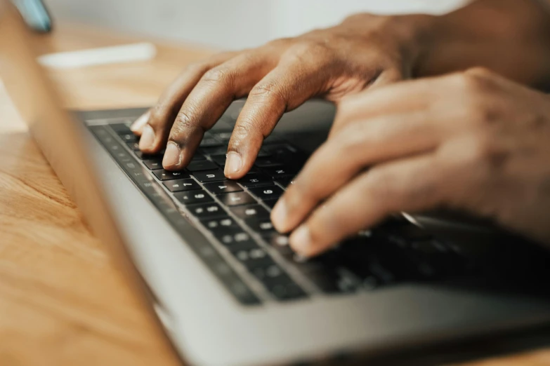 a close up of a person typing on a laptop, by Carey Morris, pexels, multiple stories, richly textured, thumbnail, realistic style