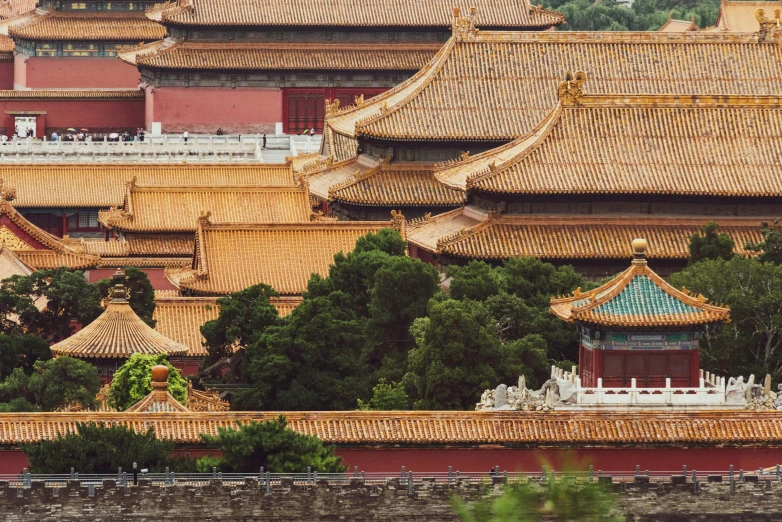 a group of buildings sitting on top of a lush green hillside, inspired by Wang Yi, trending on unsplash, cloisonnism, in forbidden city, square, brown, exterior photo