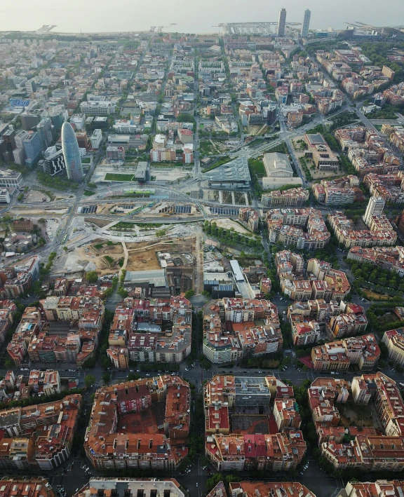 an aerial view of a city with lots of buildings, by Modest Urgell, happening, brown, square, transparent, high quality image”