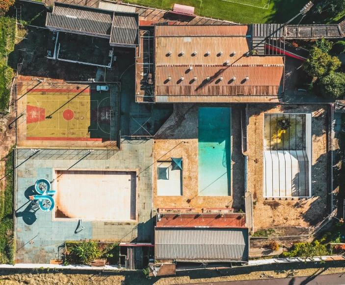 an aerial view of a house under construction, an album cover, pexels contest winner, modernism, skate park, pool, rusty, lachlan bailey