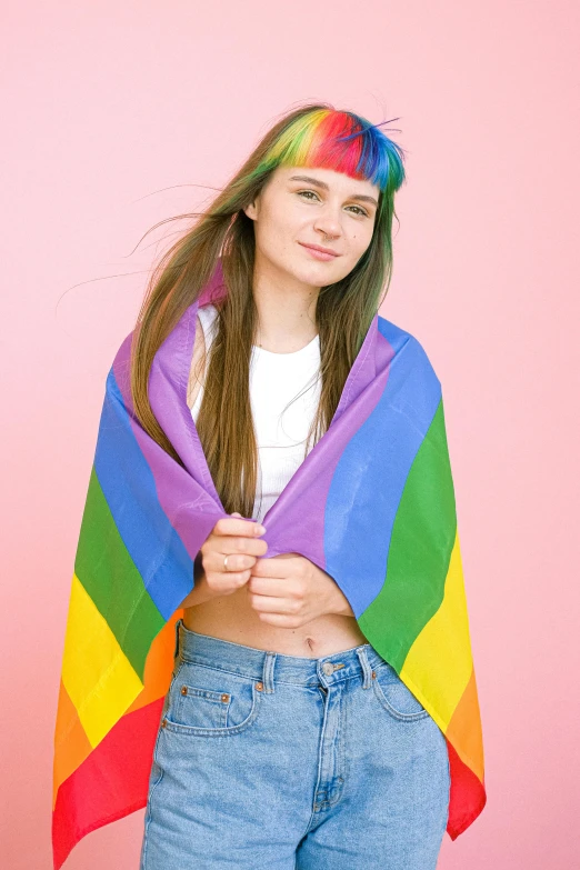 a woman wearing a rainbow colored shawl on a pink background, trending on pexels, male teenager, college girls, h3h3, bandanas