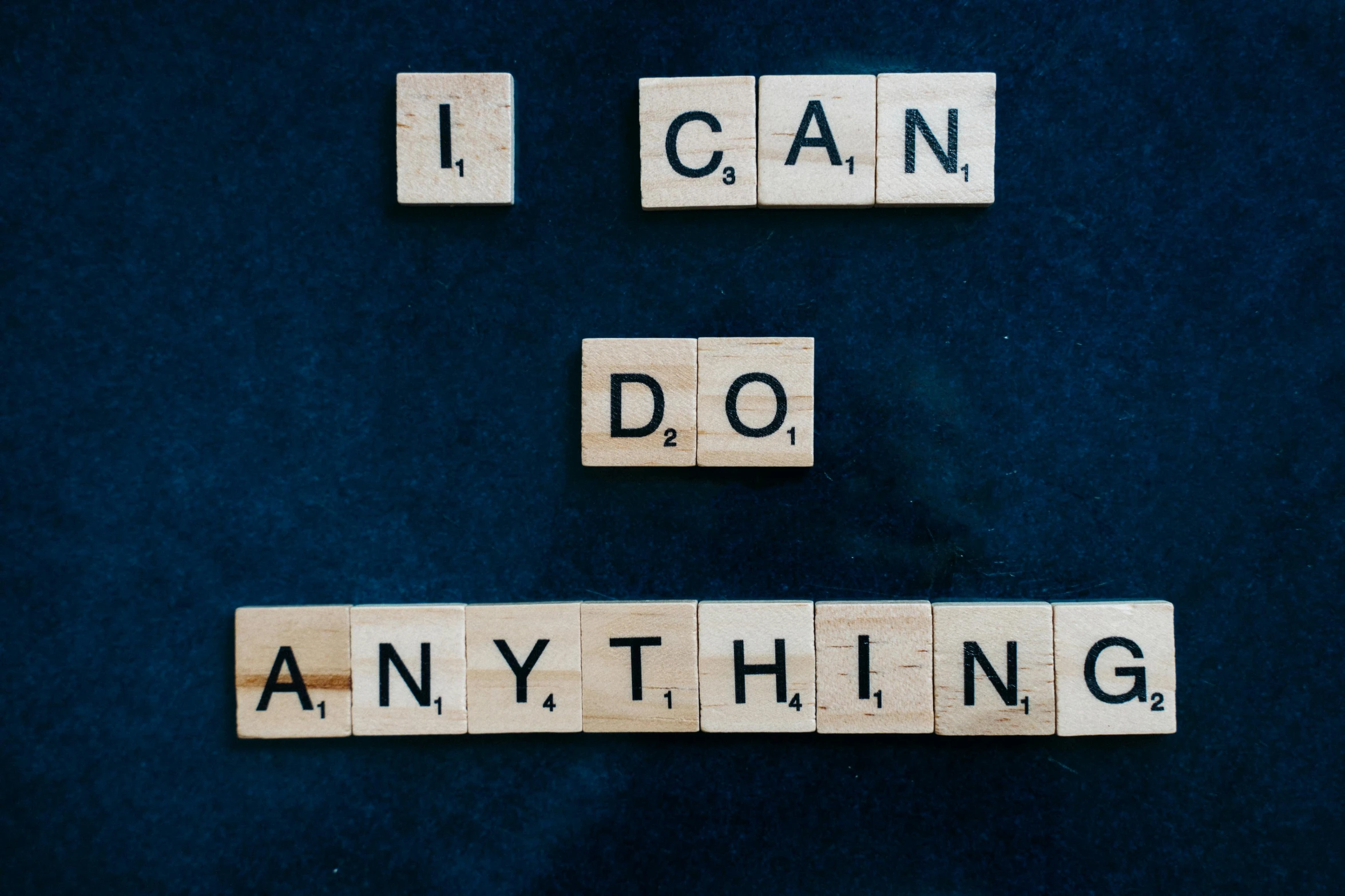 scrabbles spelling i can do anything on a blue background, a picture, by Anna Katharina Block, trending on unsplash, with a black background, my little everything, anything that comes into my mind, and