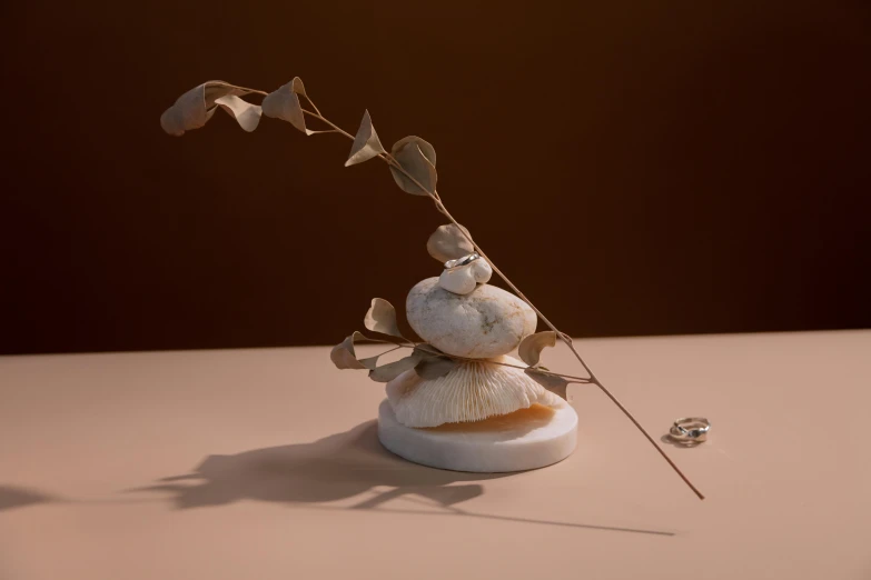 a white vase sitting on top of a table, a surrealist sculpture, inspired by Gong Kai, unsplash, 3d render 8k, fungus and plants, incense, lecherous pose