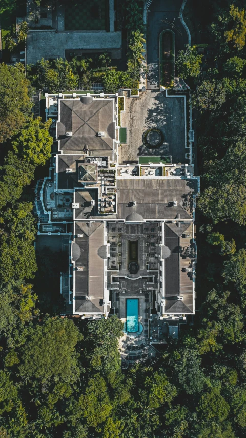 an aerial view of a mansion surrounded by trees, by Byron Galvez, pexels contest winner, rooftop, floor plan view, gif, resort