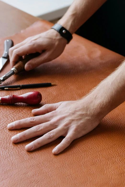 a person cutting leather with a pair of scissors, thumbnail, manly design, inspect in inventory image, masterpiece fine details