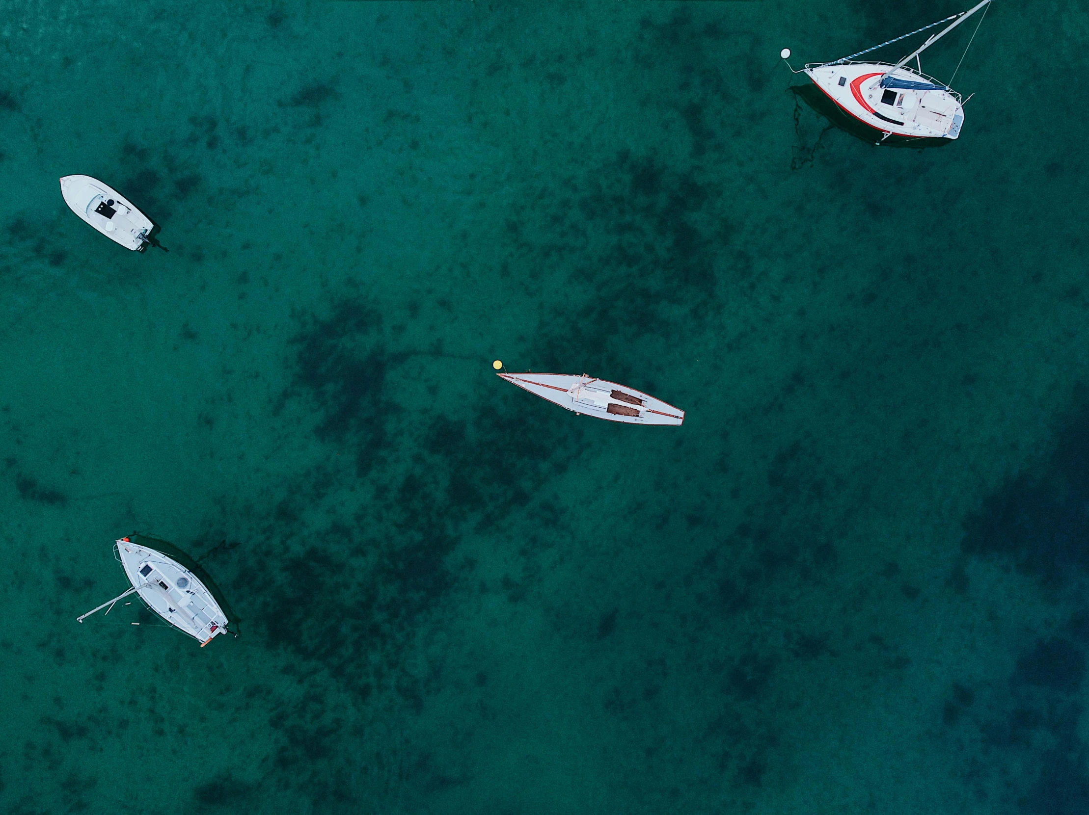 a group of boats floating on top of a body of water, a screenshot, pexels contest winner, minimalism, birds eye, fan favorite, robb cobb, ultrawide shots