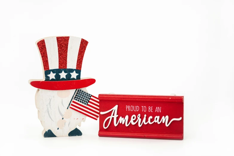 a wooden sign that says proud to be an american, a picture, inspired by Americo Makk, shutterstock, wooden art toys on base, silver red white details, set against a white background, folded arms