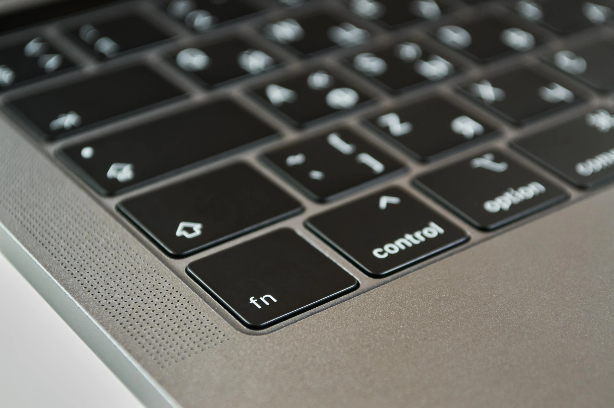 a close up of a keyboard on a laptop, a computer rendering, by Carey Morris, pixabay, shiny metallic glossy skin, thumbnail, engraved, grey metal body