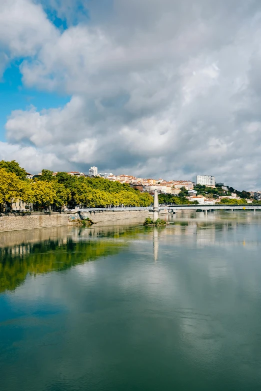 a large body of water surrounded by trees, visual art, outdoors european cityscape, slide show, taken with sony alpha 9, wine