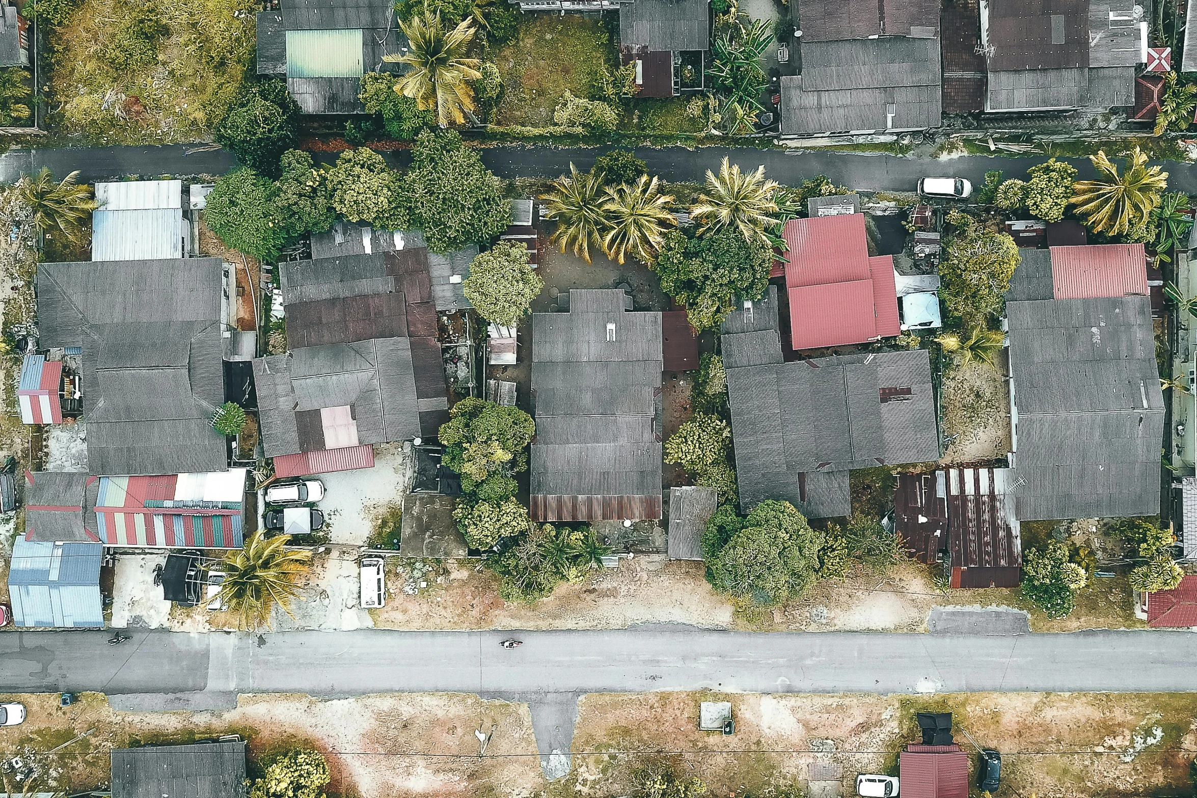 a bird's eye view of a residential area, unsplash, photorealism, reunion island, photo of poor condition, ilustration, 2 d overhead view