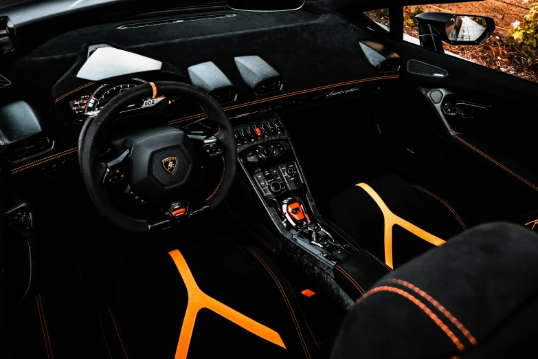 the interior of a black and orange sports car, by Julia Pishtar, pexels contest winner, renaissance, lamborghini, the console is tall and imposing, clean 4 k, detailed high resolution