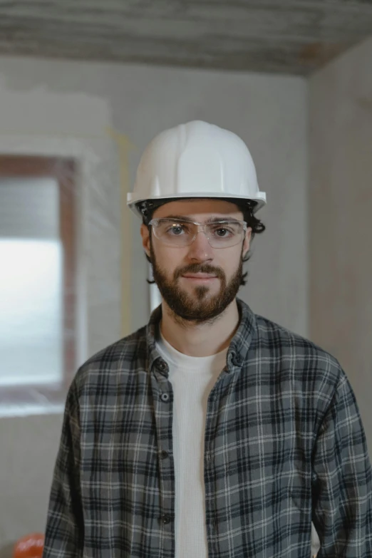 a man wearing a hard hat and glasses, pexels contest winner, renaissance, scruffy looking, fit build, caucasian, instagram post
