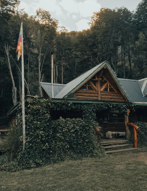 a house sitting in the middle of a lush green forest, heidelberg school, profile image, log cabin, thumbnail, fire lit