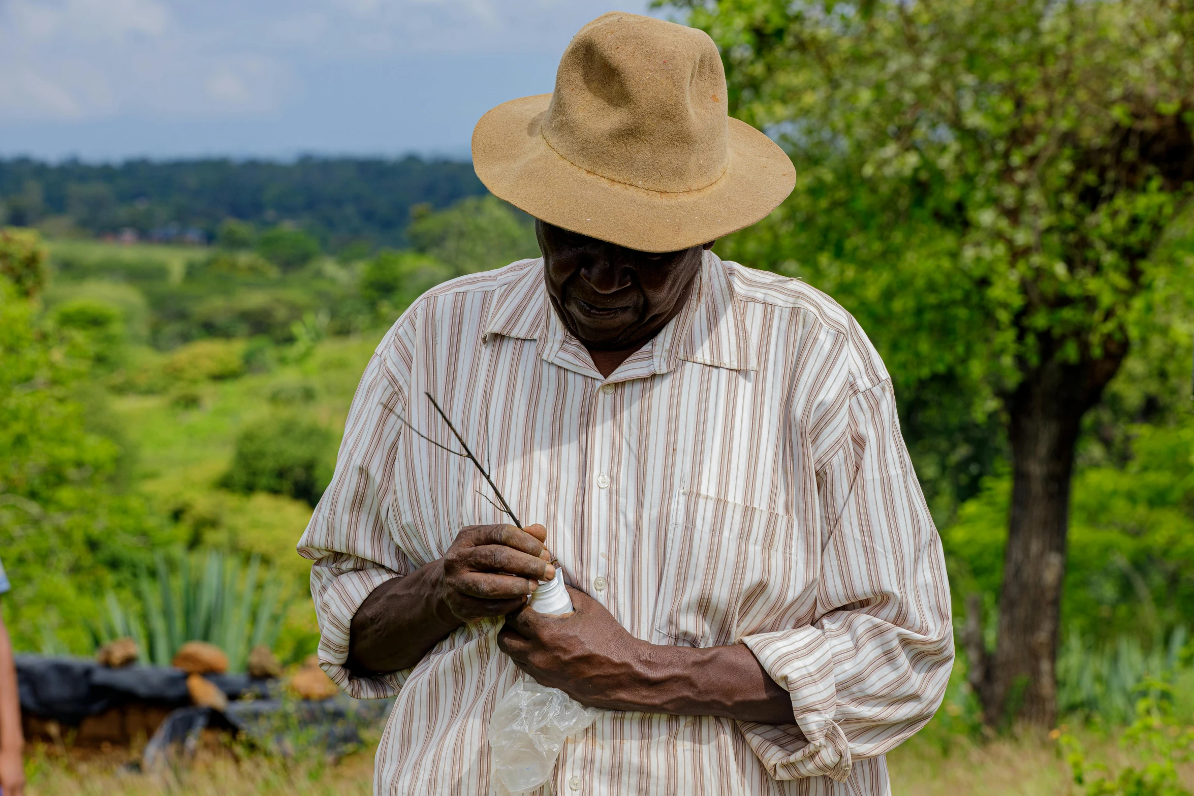 a man that is standing in the grass, carefully crafted, very kenyan, profile image