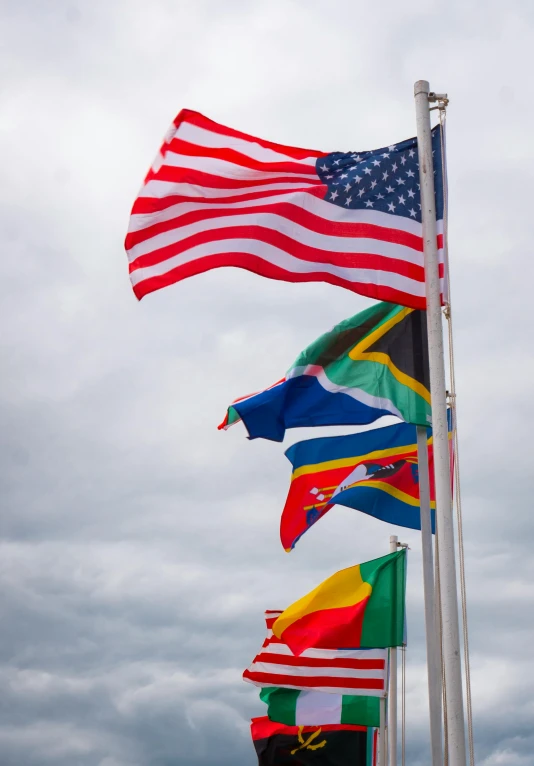 a bunch of flags that are flying in the air, slide show, afroamerican, around the world, avatar image