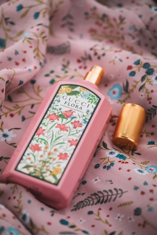 a bottle of perfume sitting on top of a bed, rococo, wearing pink floral chiton, indiecraft aesthetic, product view, in pink forest