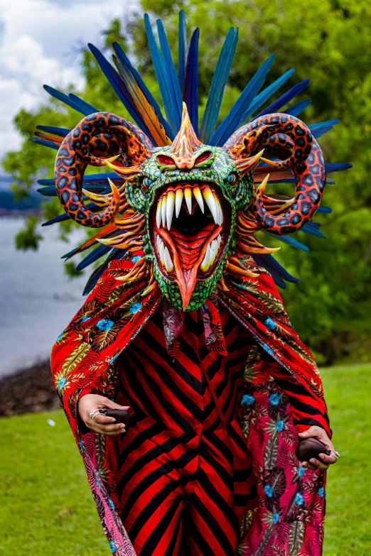 a close up of a person wearing a costume, an album cover, by Robert Brackman, sumatraism, draconians, mexican, guardian of the holy lake, grimacing