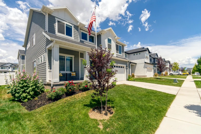 a house with a flag in front of it, unsplash, utah, mixed development, slide show, exterior photography