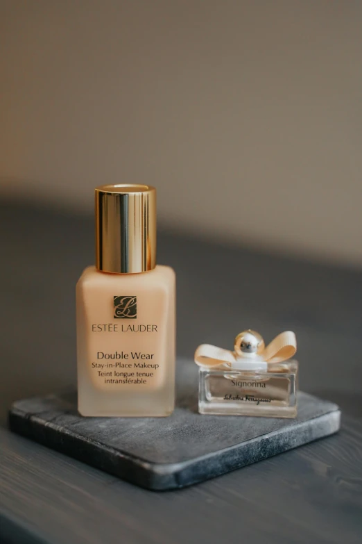 a bottle of liquid sitting on top of a table, a picture, ivory make up, detailed product image, petite, thumbnail