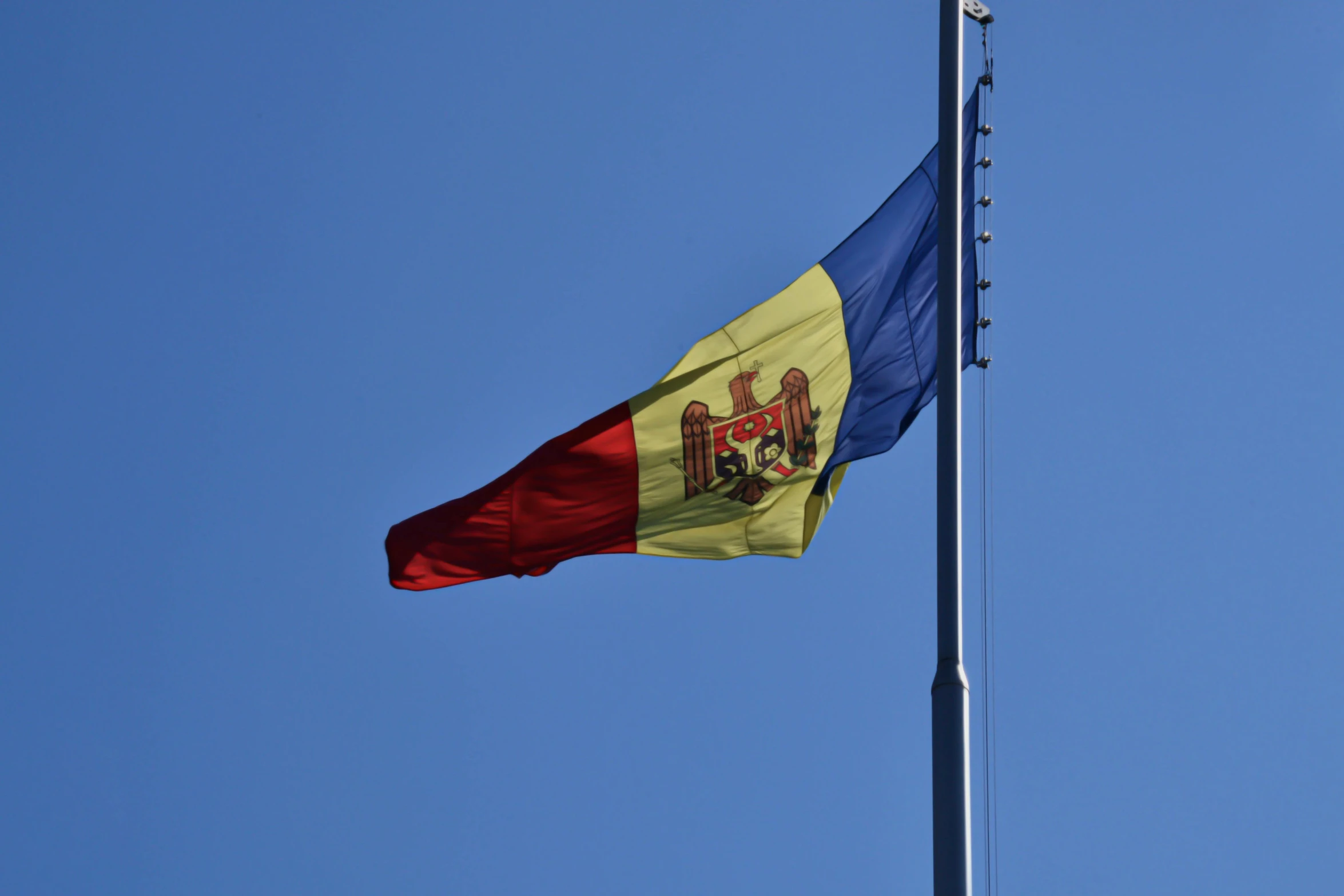 the flag is flying high in the blue sky, by Julia Pishtar, pexels, hurufiyya, romanian heritage, square, 15081959 21121991 01012000 4k, against dark background