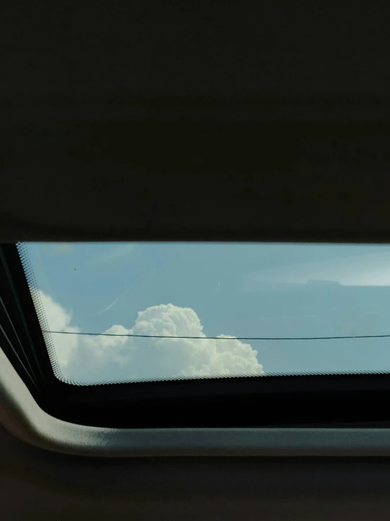 a view of the sky through a car window, by Neil Blevins, postminimalism, hot day, photograph taken in 2 0 2 0, interstellar hyper realism, sunny sky light